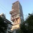 Skyscraper for one: billionaire Mukesh Ambani's 27-storey home 'Antilia' towers over adjacent apartment buildings in Altamount Road, South Mumbai. Photo: Kerwin Datu